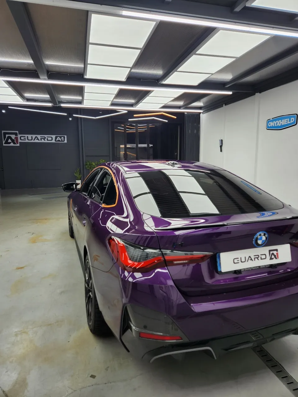 BMW i4 vinyl wrap - BMW i4 Vinyl Wrap Review: Glossy Black Upgrade photo 4