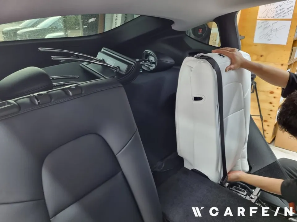 Tesla Model Y interior customization - Tesla Model Y Interior Customization Review — White Seat Upgrade photo 4