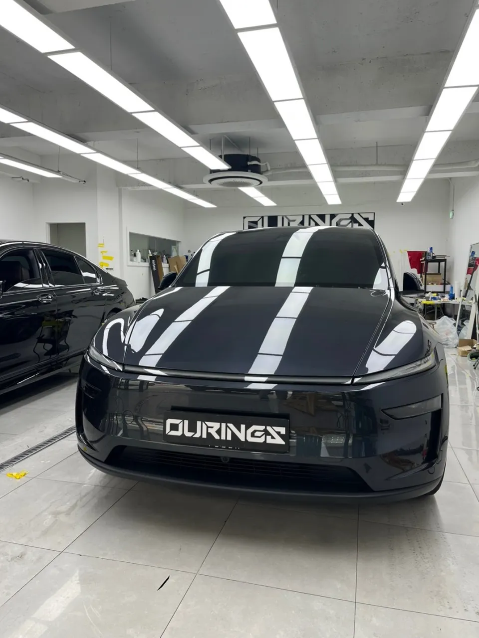 Tesla Model Y vinyl wrap - Tesla Model Y Vinyl Wrap Review: Satin Black Cost & Results photo 3